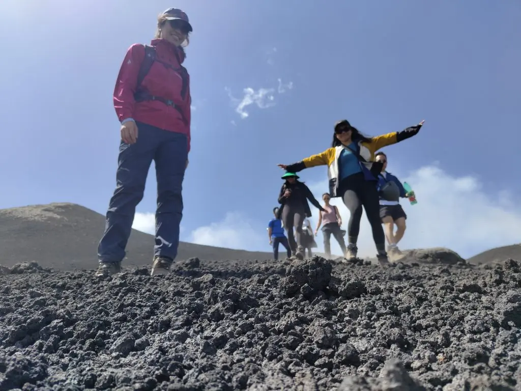 Hikers exploring local culture of Mount Etna on a guided hike